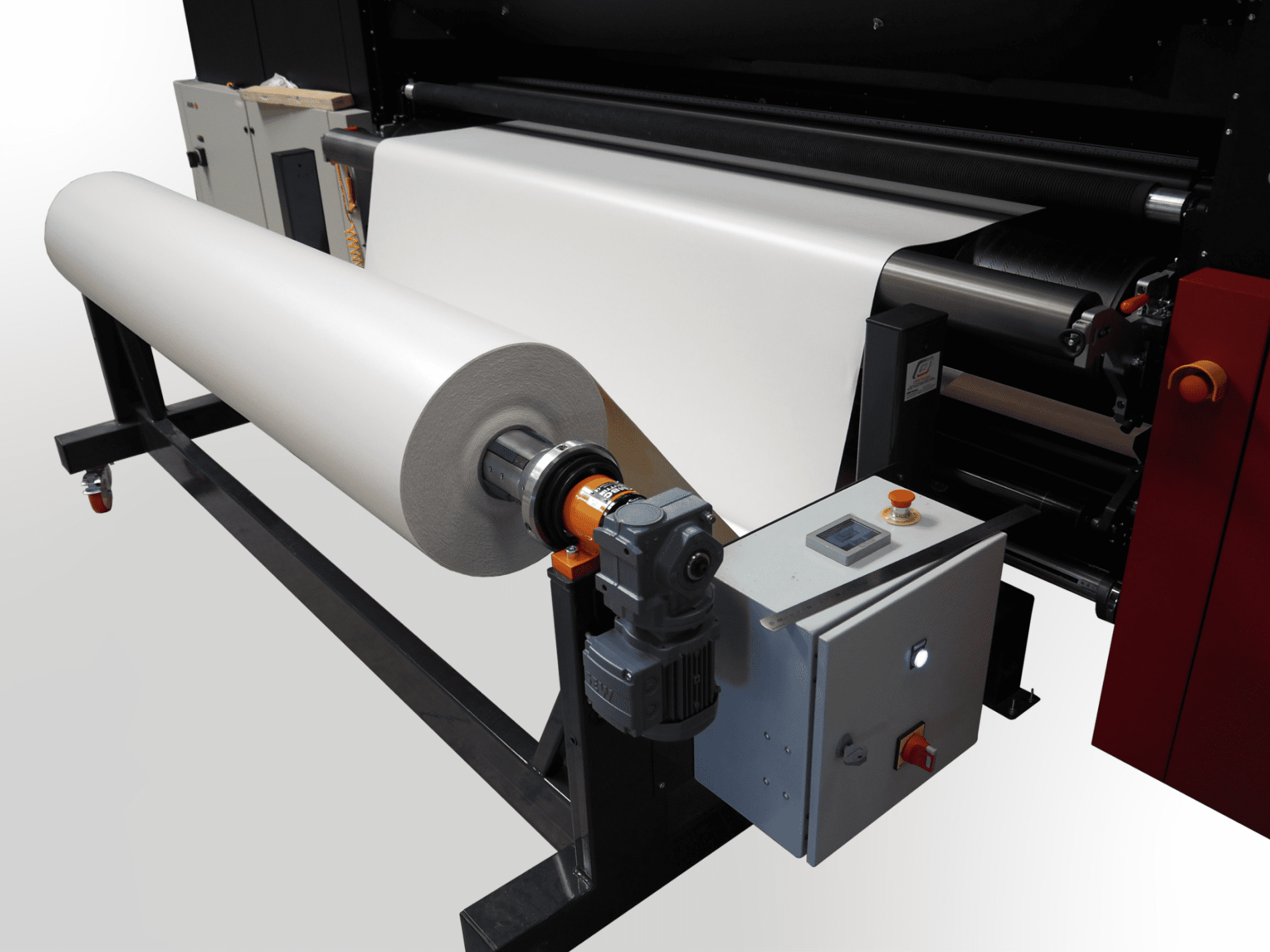 Dérouleur motorisé en contrôle de tension en entrée d'une imprimante grand format